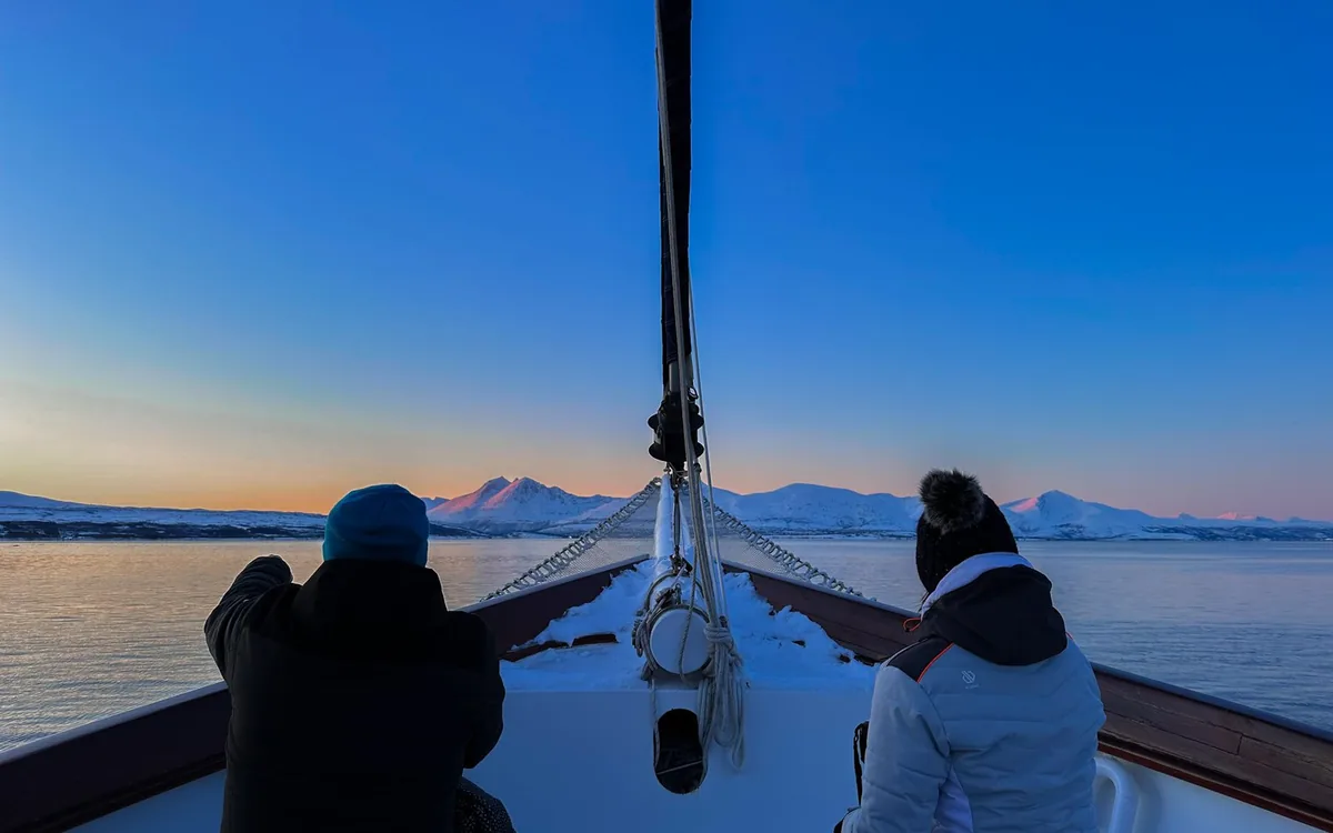 The midnight sun over a fjord near Tromso