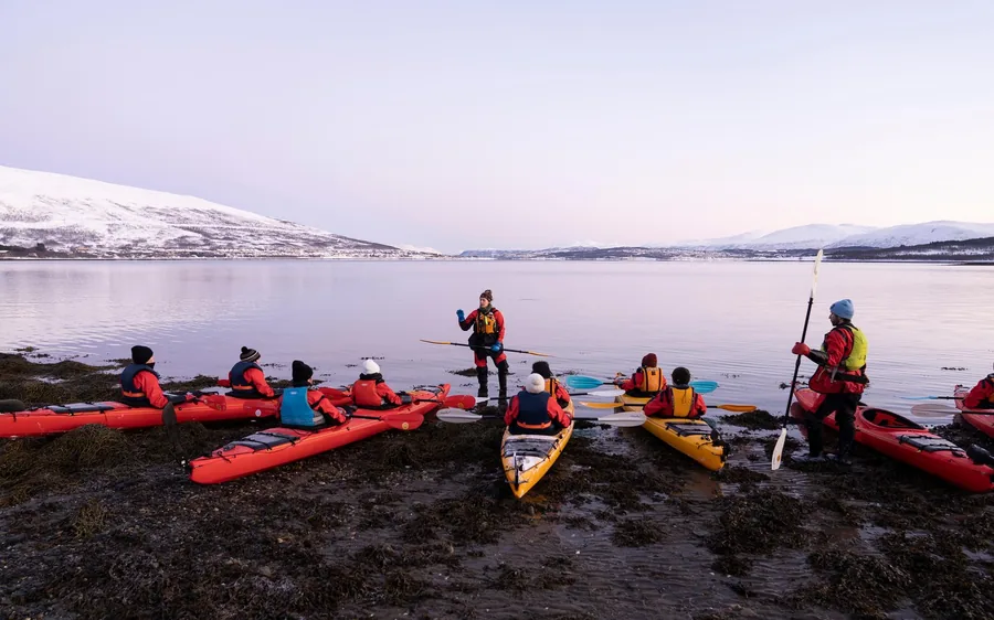 Sea kayaks on an Arctic beach near Tromso in winter