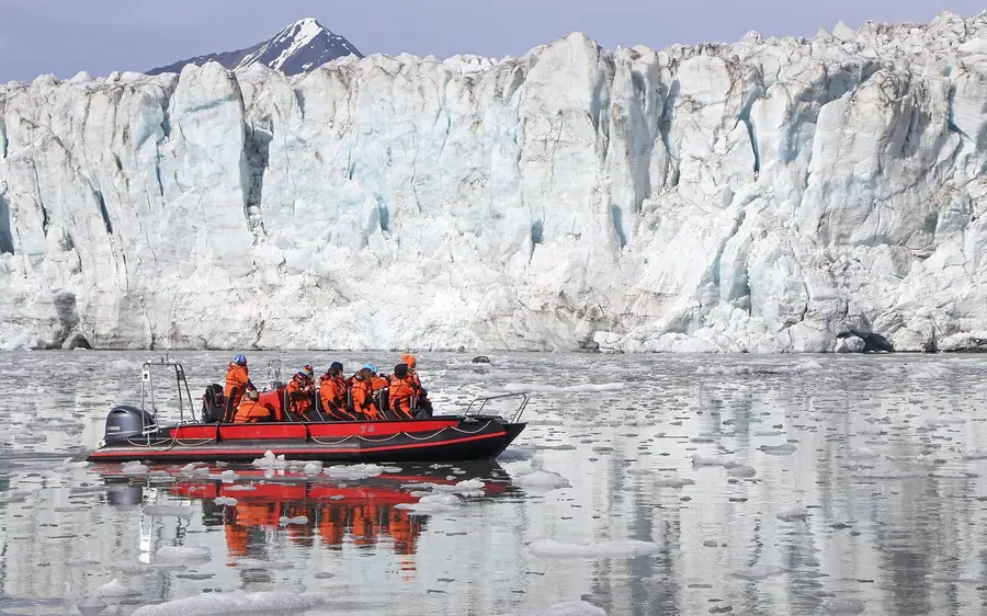 A glacier front and boat near Pyramiden on Svalbard